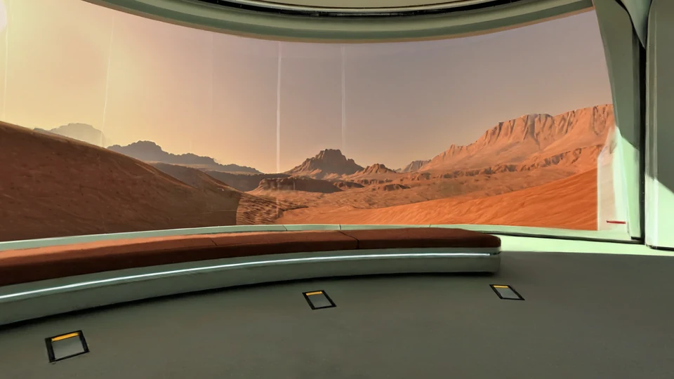 Scientific observatory with panoramic windows facing rust-red desert cliffs