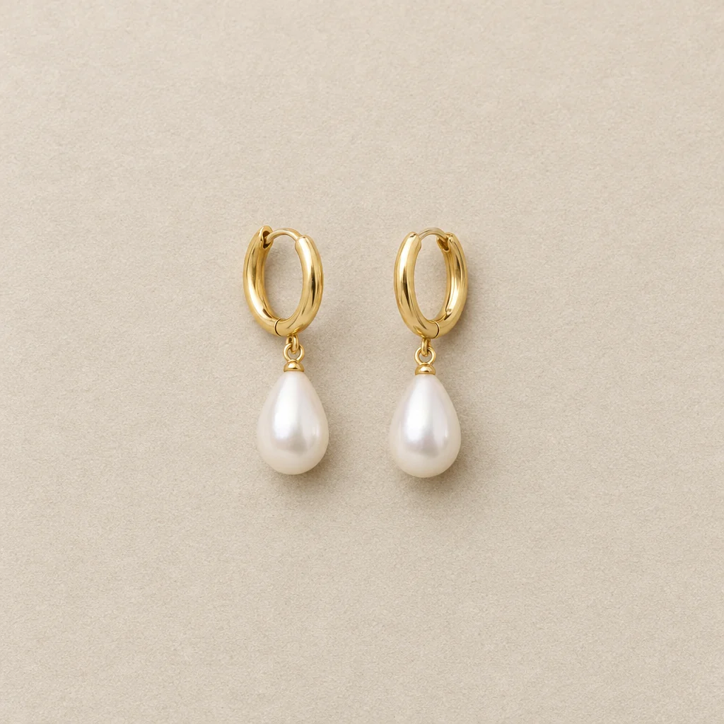 Gold and pearl drop earrings — Studio jewelry concept showing metal finish and connected components