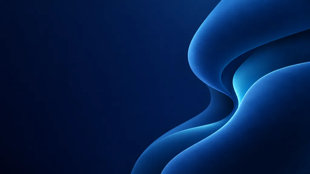 Abstract desktop wallpaper with smooth blue curved forms, soft highlights and open space